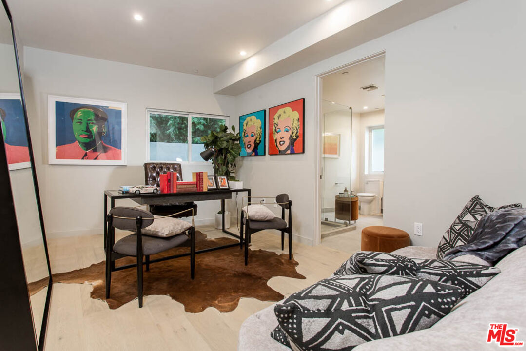 1621 Malcolm Avenue, Unit 101 Los Angeles, CA 90024 - Photo 26 of 34 a living room with furniture and a window