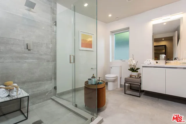a picture of a bathroom with a sink and a mirror
