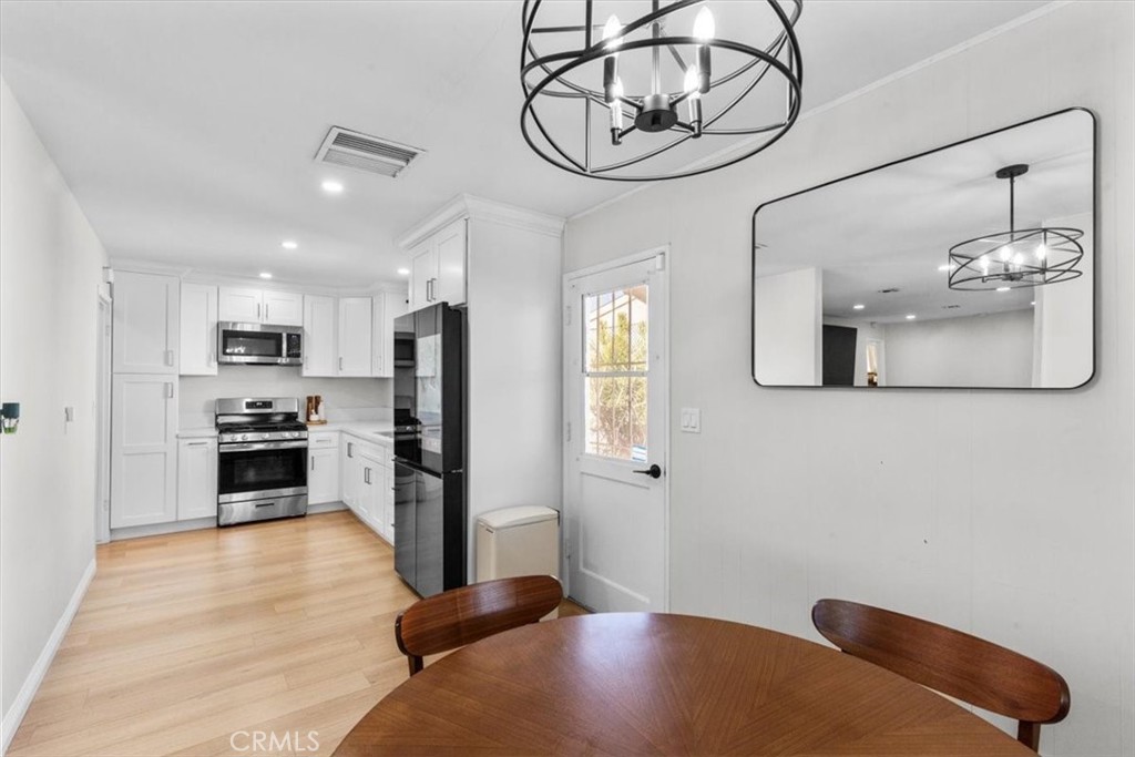 565 North Riverside Avenue Rialto, CA 92376 - Photo 8 of 19 a view of a kitchen with furniture and stainless steel appliances