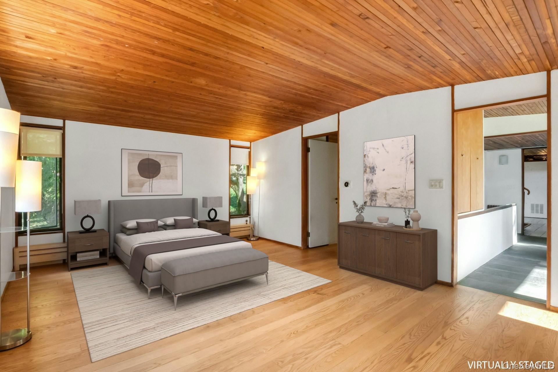 309 Scarborough Road Briarcliff Manor, NY 10510 - Photo 24 of 50 a bedroom with a bed and wooden floor