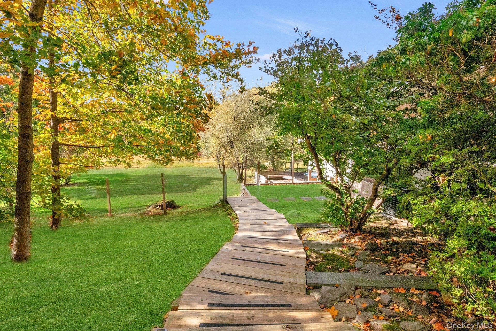 309 Scarborough Road Briarcliff Manor, NY 10510 - Photo 29 of 50 a walkway with trees in the background