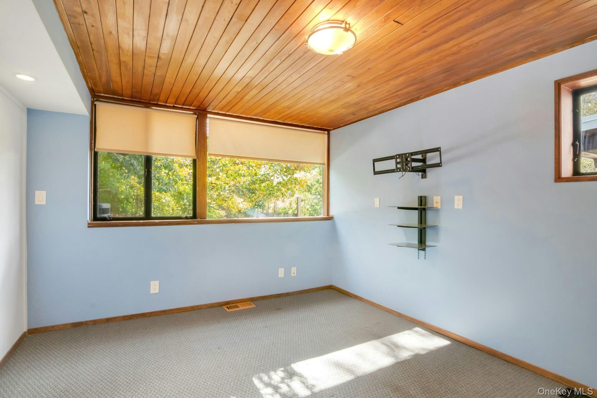 309 Scarborough Road Briarcliff Manor, NY 10510 - Photo 31 of 50 a view of an empty room with a window