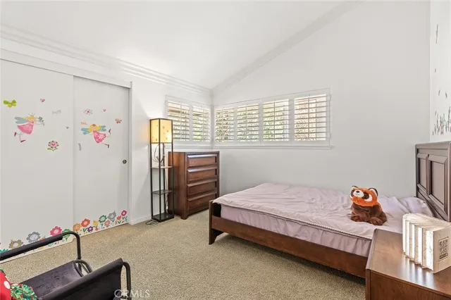 a bed room with a bed and a couch