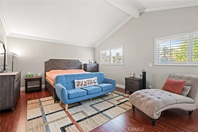 a bedroom with a bed and a couch