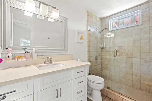 a view of a room with furniture and a large window