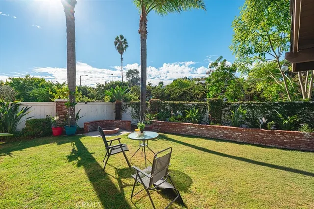 a view of house with a yard outdoor seating and entertaining space