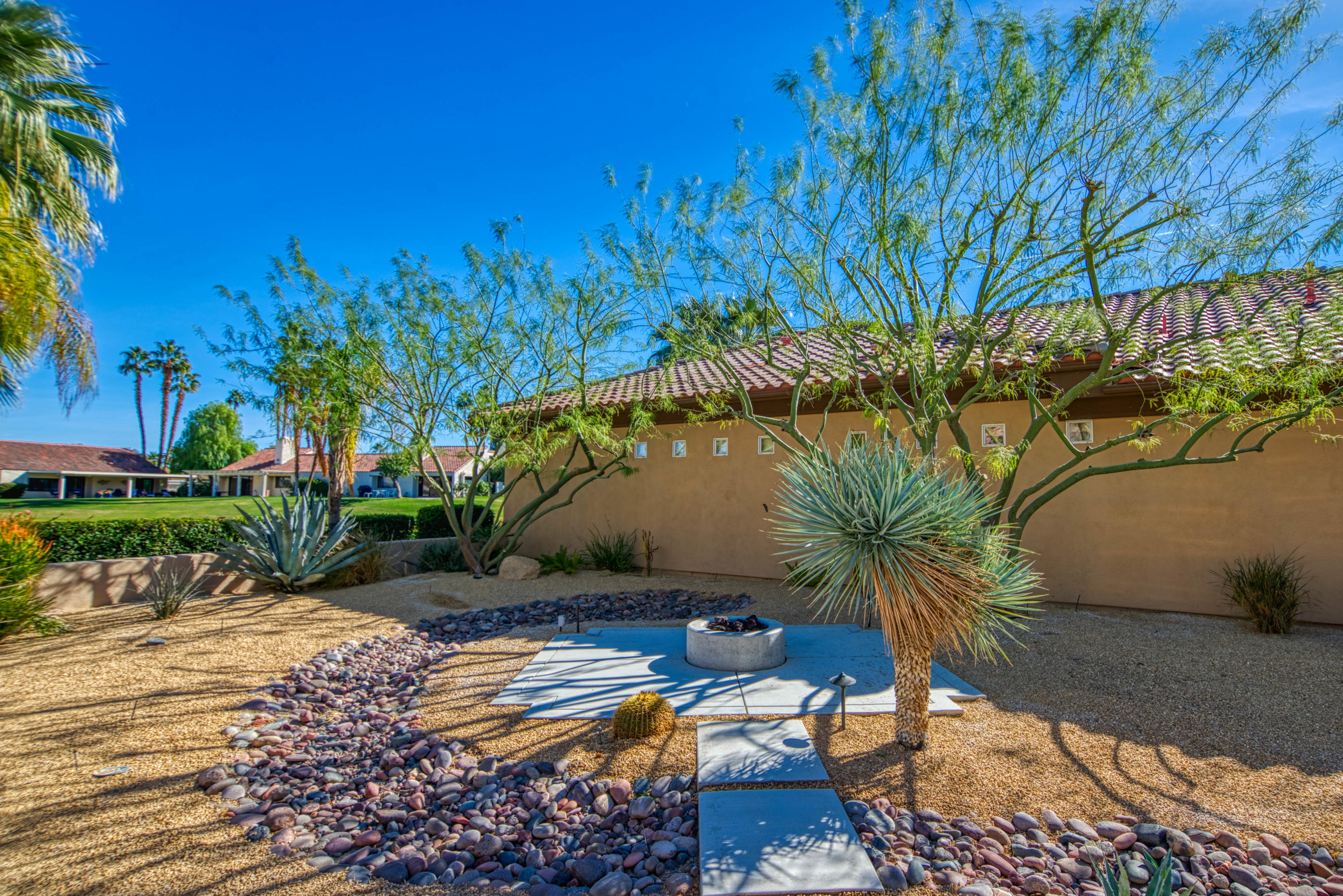 13 Wimbledon Circle Rancho Mirage, CA 92270 - Photo 21 of 62 a view of a backyard
