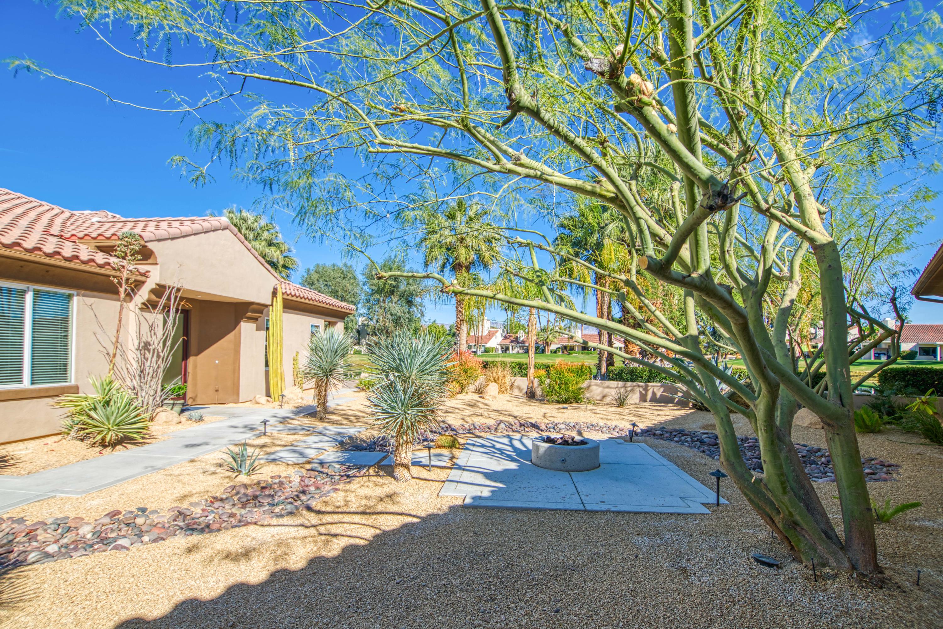 13 Wimbledon Circle Rancho Mirage, CA 92270 - Photo 29 of 62 a view of a house with a yard