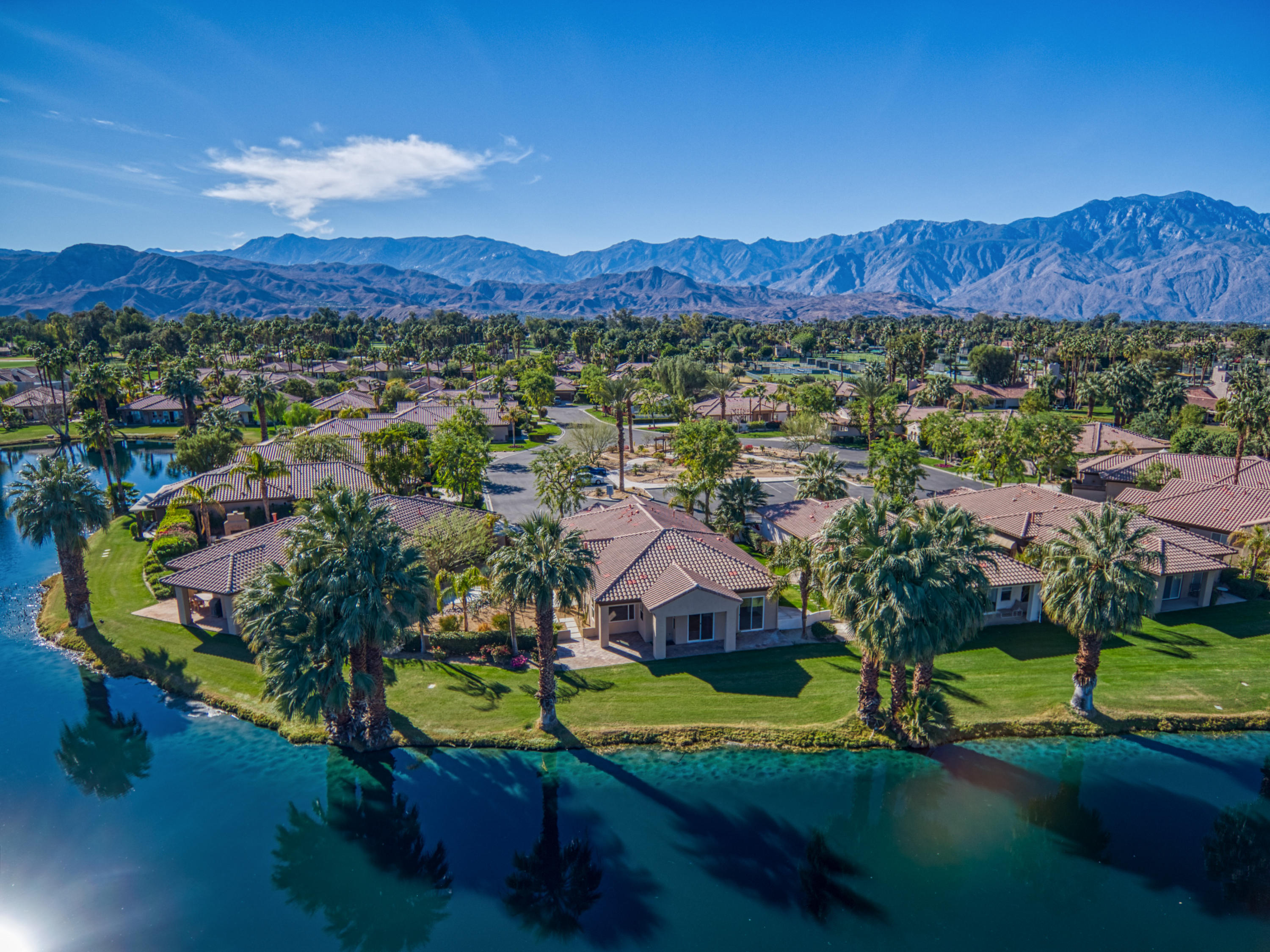 13 Wimbledon Circle Rancho Mirage, CA 92270 - Photo 4 of 62 an aerial view of residential houses with outdoor space and river