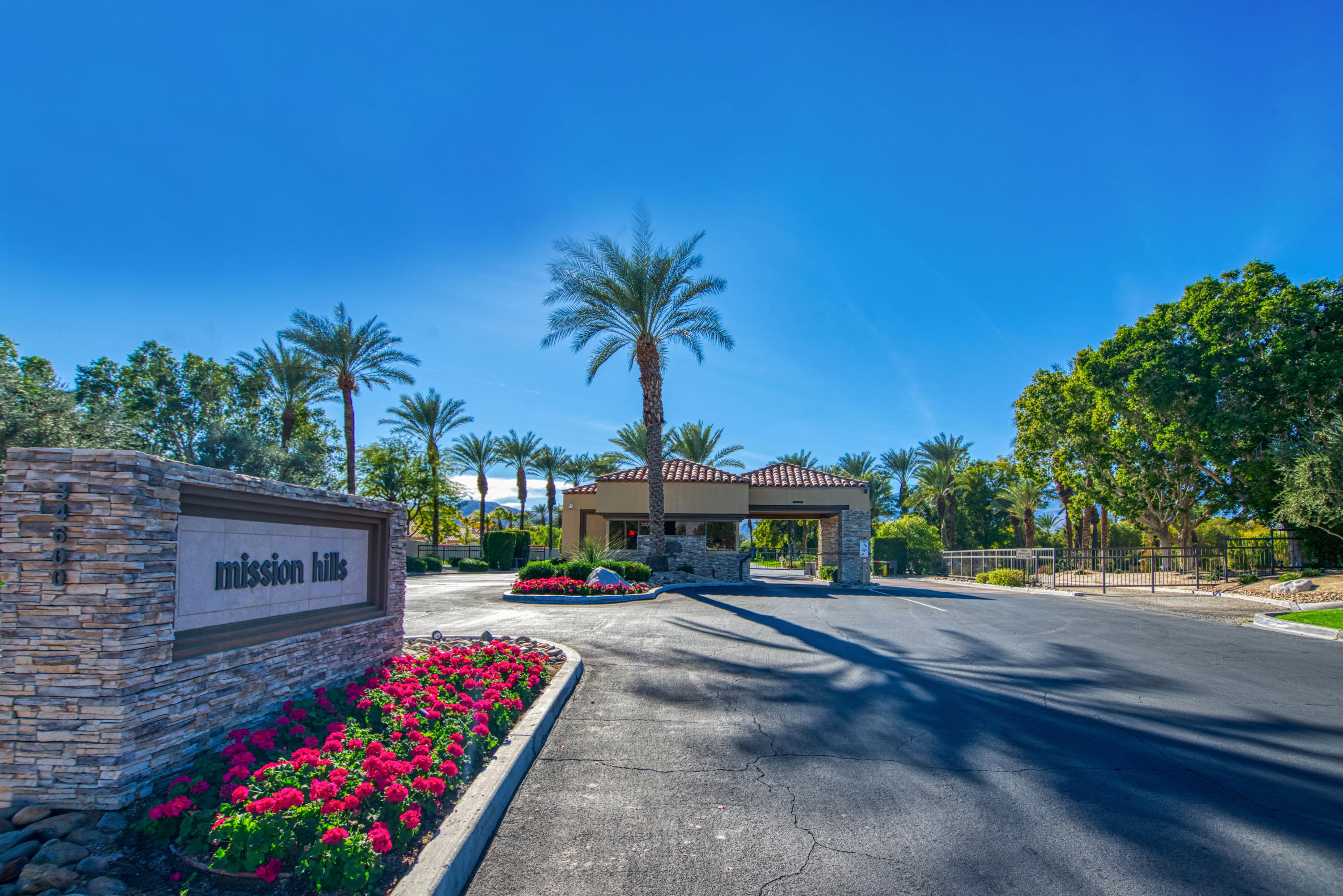 13 Wimbledon Circle Rancho Mirage, CA 92270 - Photo 31 of 62 a sign board with parking space