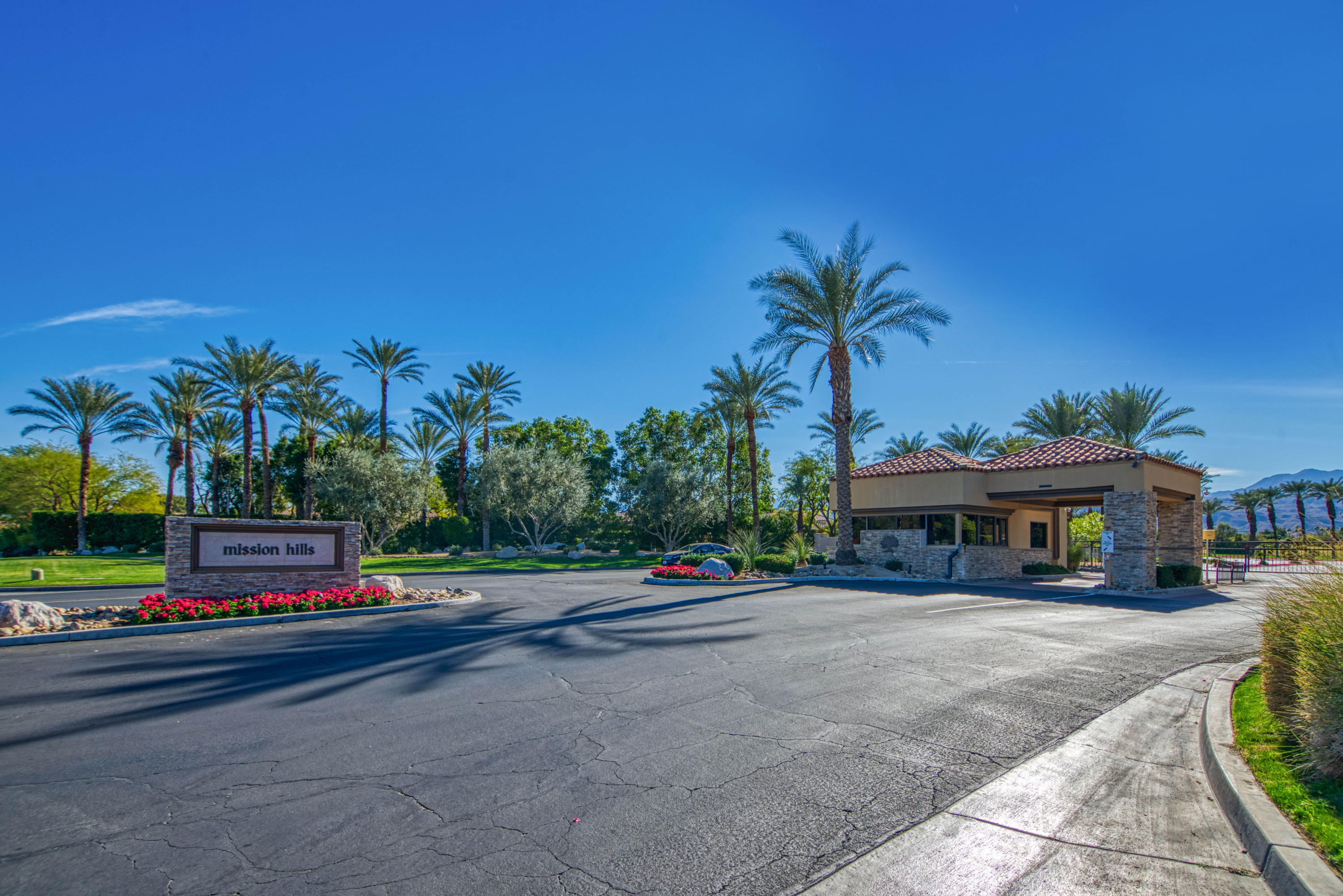 13 Wimbledon Circle Rancho Mirage, CA 92270 - Photo 32 of 62 a car parked on the side of a street