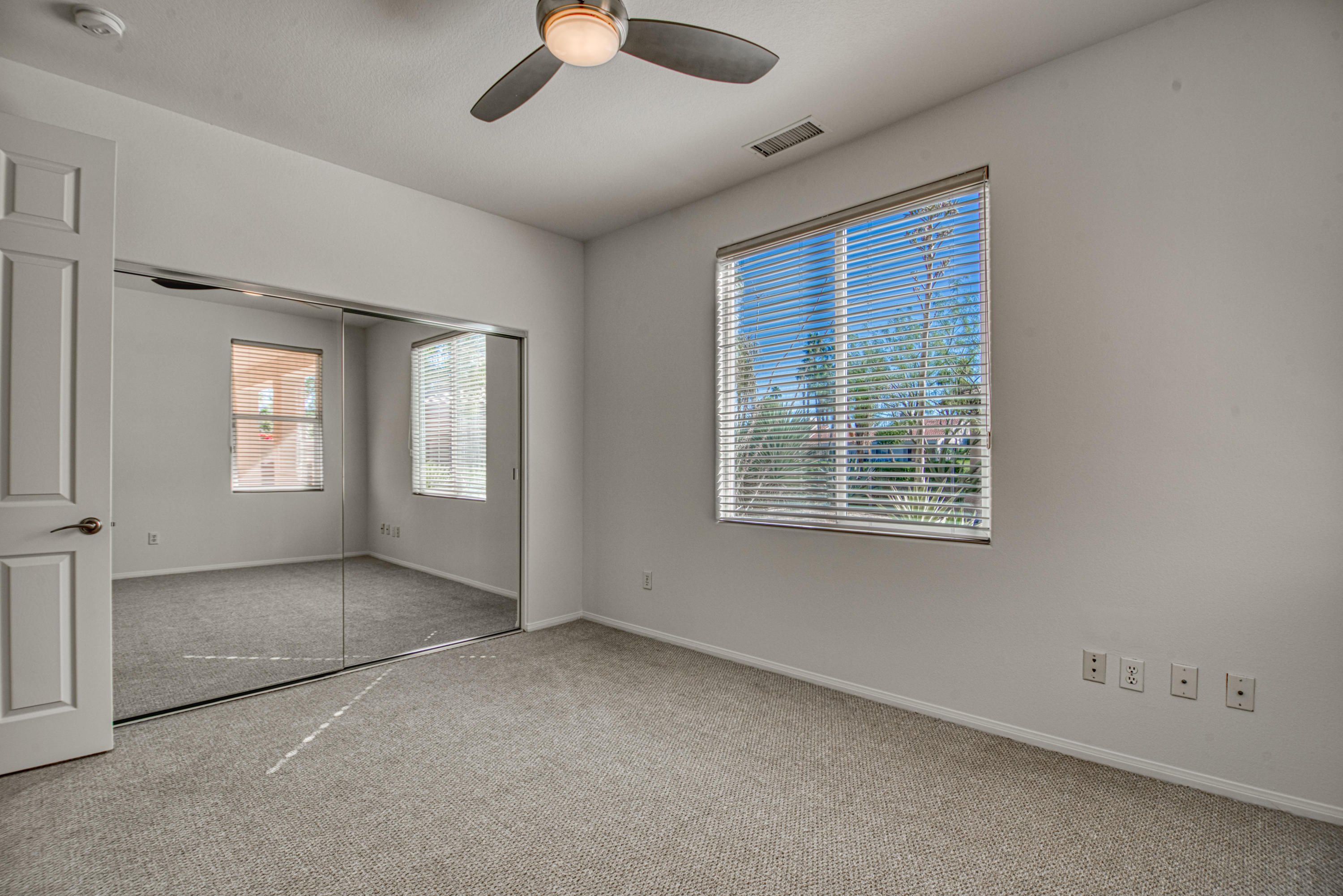 13 Wimbledon Circle Rancho Mirage, CA 92270 - Photo 33 of 62 a view of empty room with windows