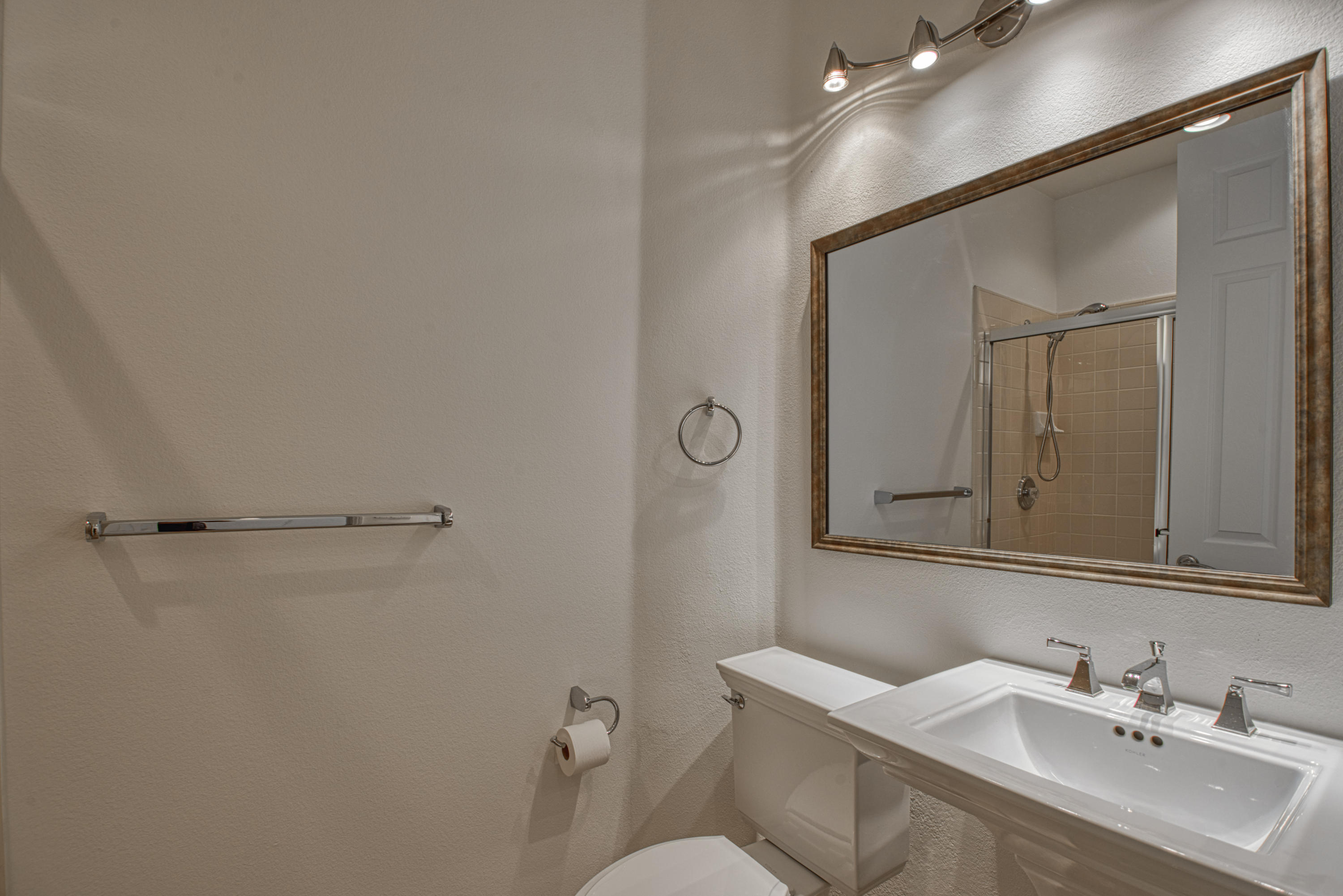 13 Wimbledon Circle Rancho Mirage, CA 92270 - Photo 34 of 62 a bathroom with a sink toilet and mirror
