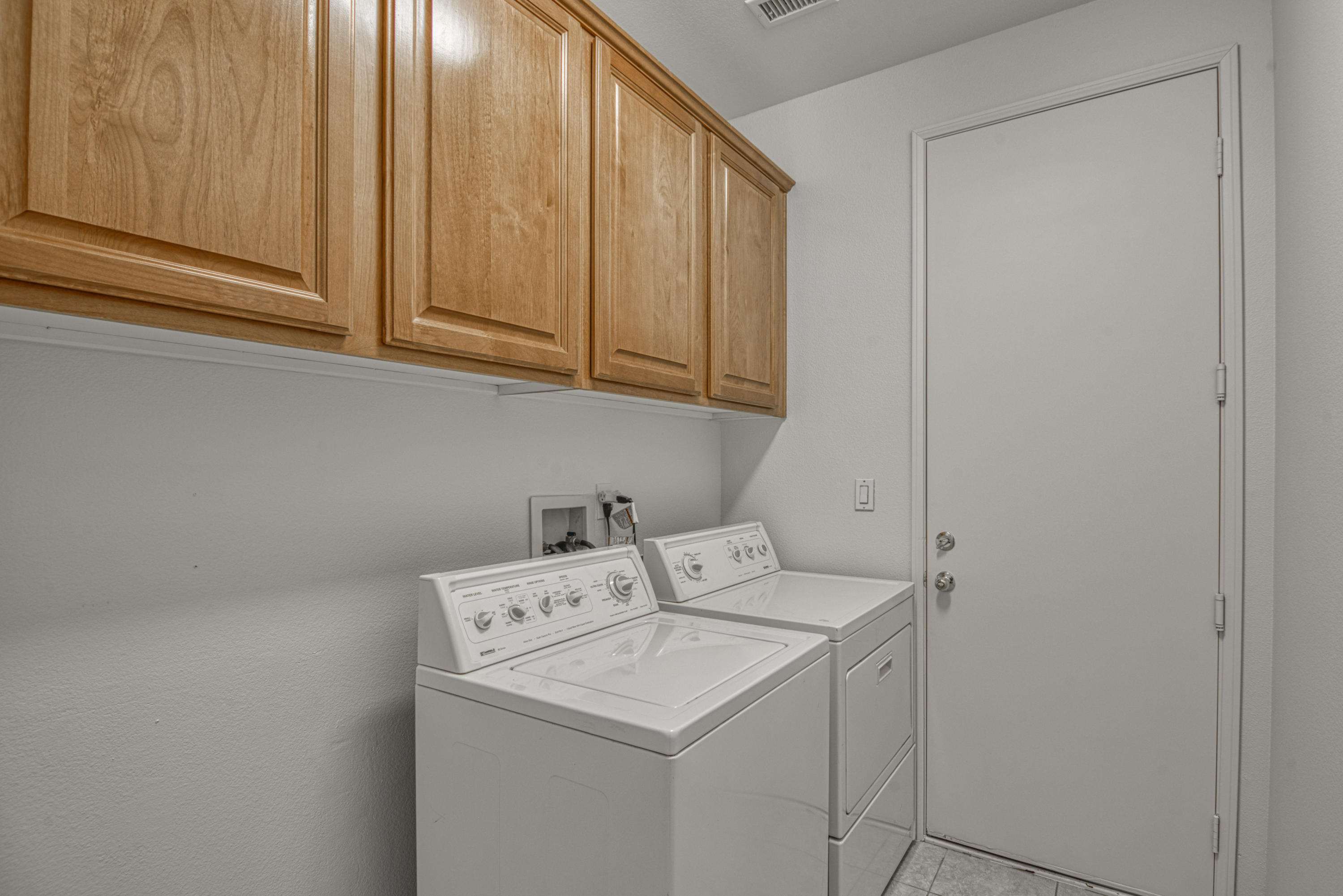 13 Wimbledon Circle Rancho Mirage, CA 92270 - Photo 36 of 62 a utility room with dryer and washer