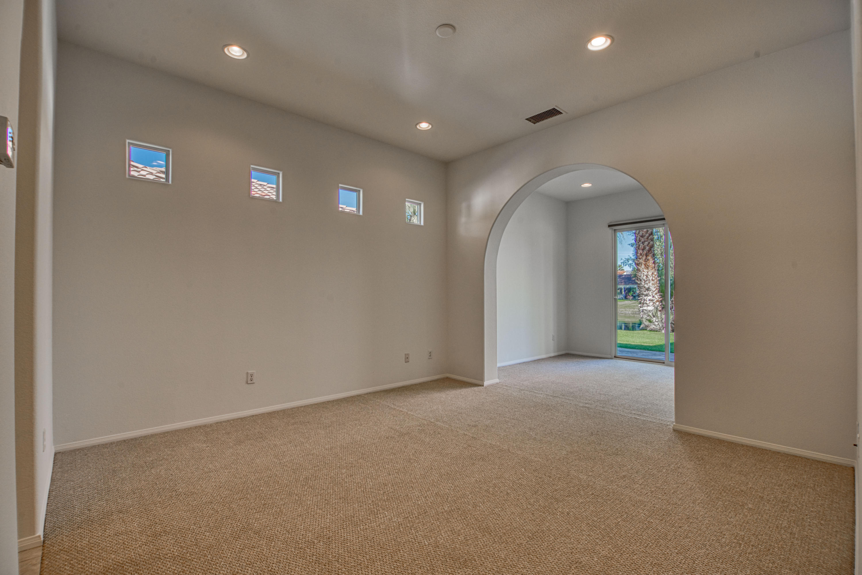 13 Wimbledon Circle Rancho Mirage, CA 92270 - Photo 40 of 62 a view of an empty room with a window