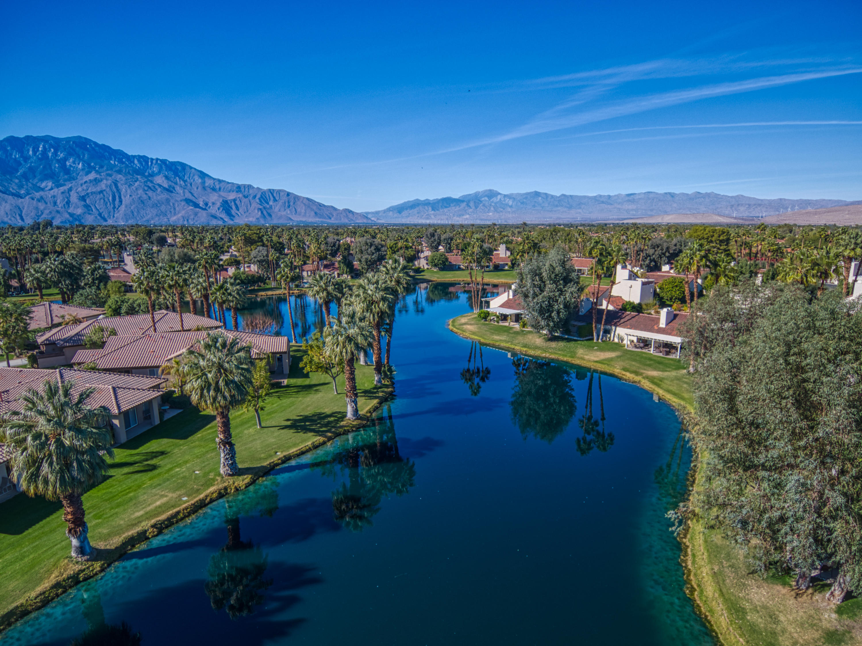 13 Wimbledon Circle Rancho Mirage, CA 92270 - Photo 5 of 62 a view of a lake with a mountain in the background