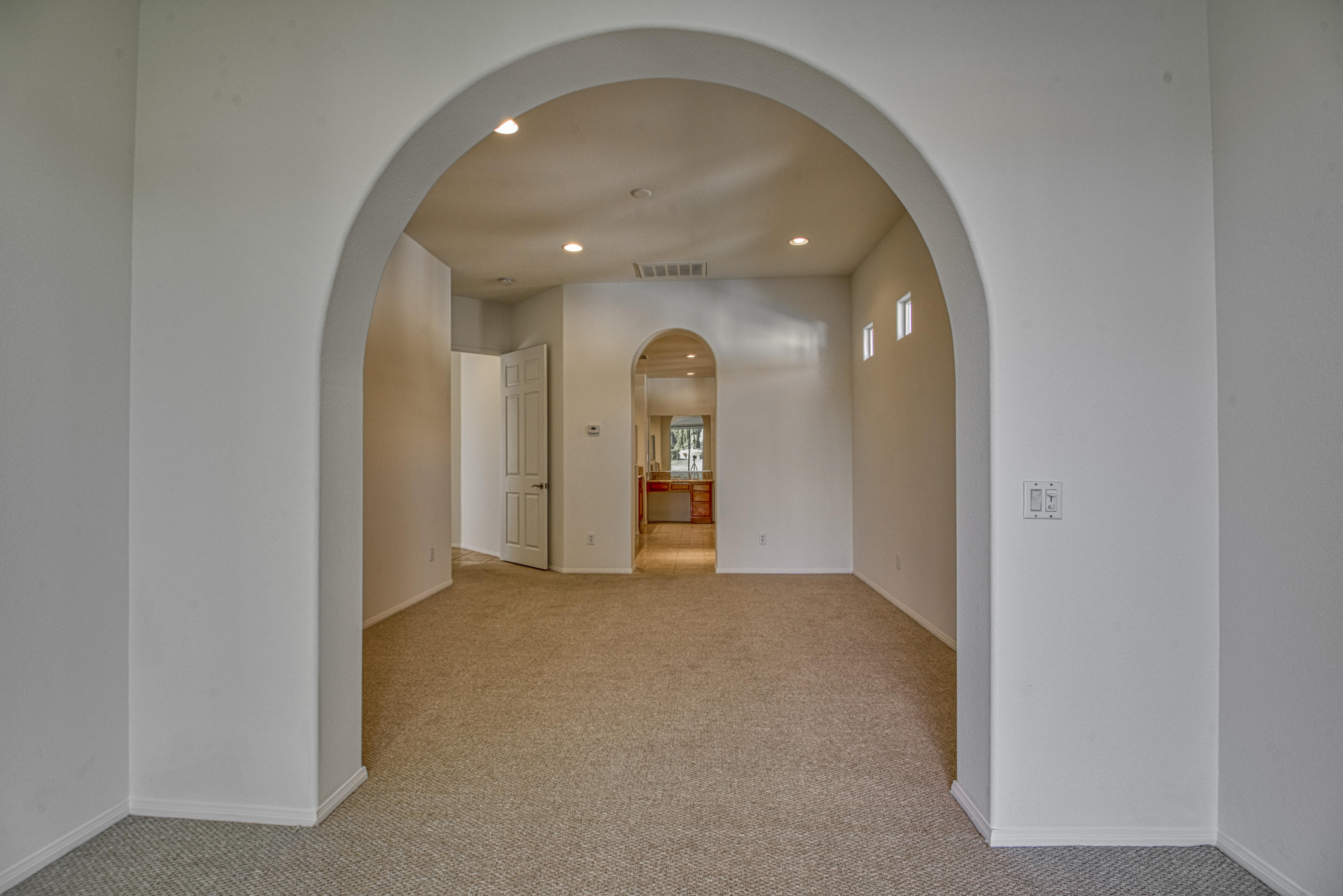 13 Wimbledon Circle Rancho Mirage, CA 92270 - Photo 41 of 62 an empty room with a bathroom and mirror