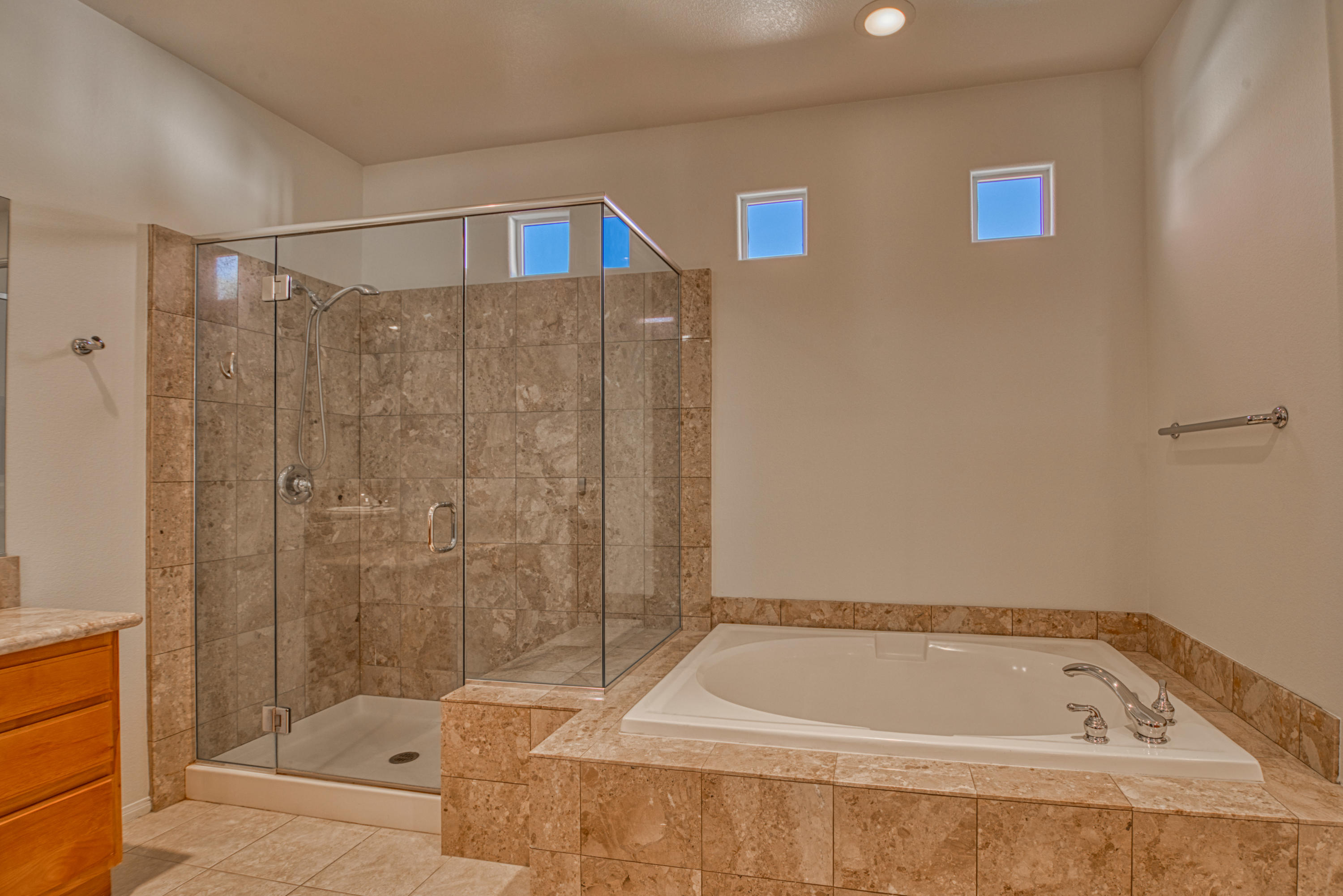 13 Wimbledon Circle Rancho Mirage, CA 92270 - Photo 44 of 62 a bathroom with a tub a sink and a shower