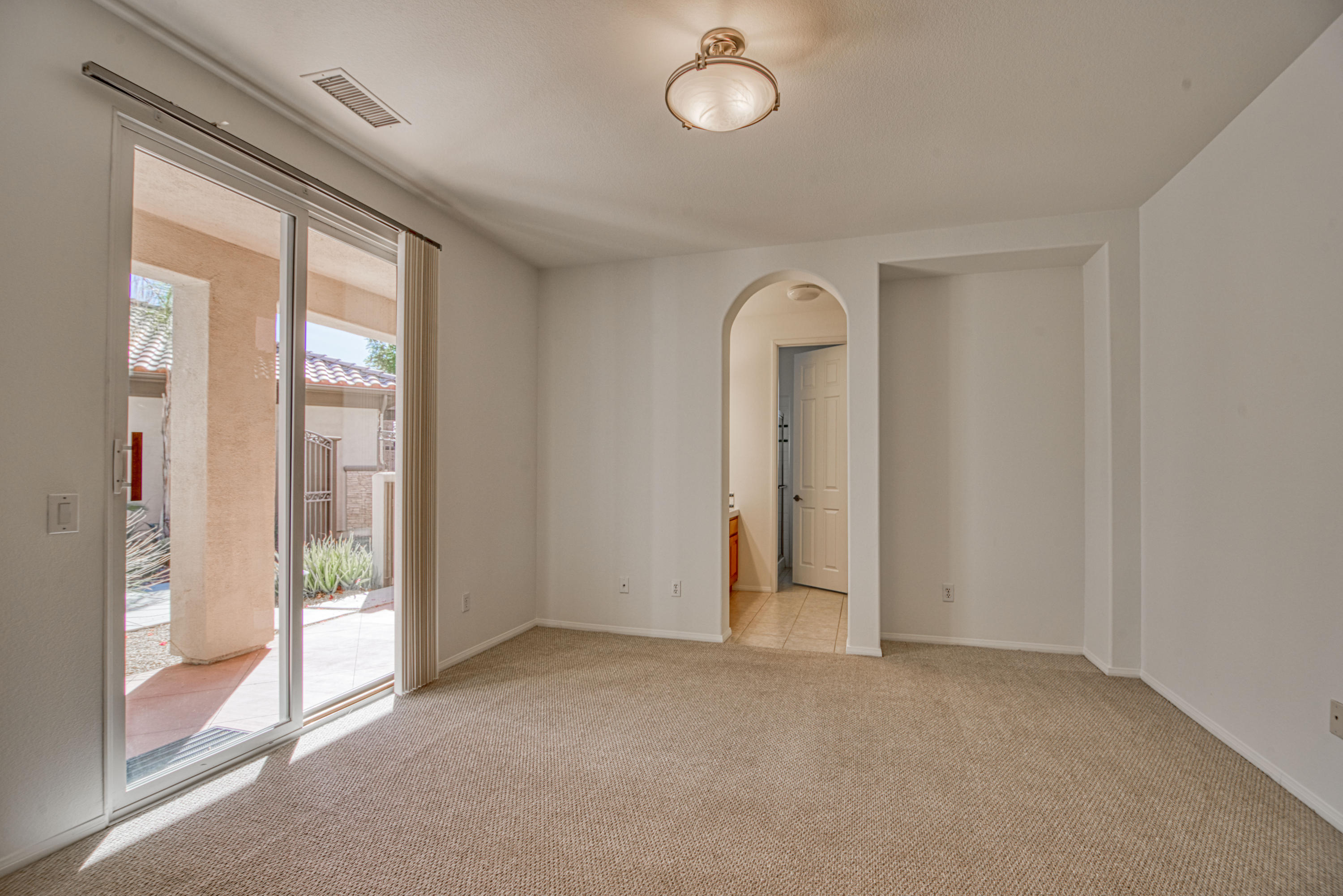 13 Wimbledon Circle Rancho Mirage, CA 92270 - Photo 47 of 62 an empty room with windows and closet