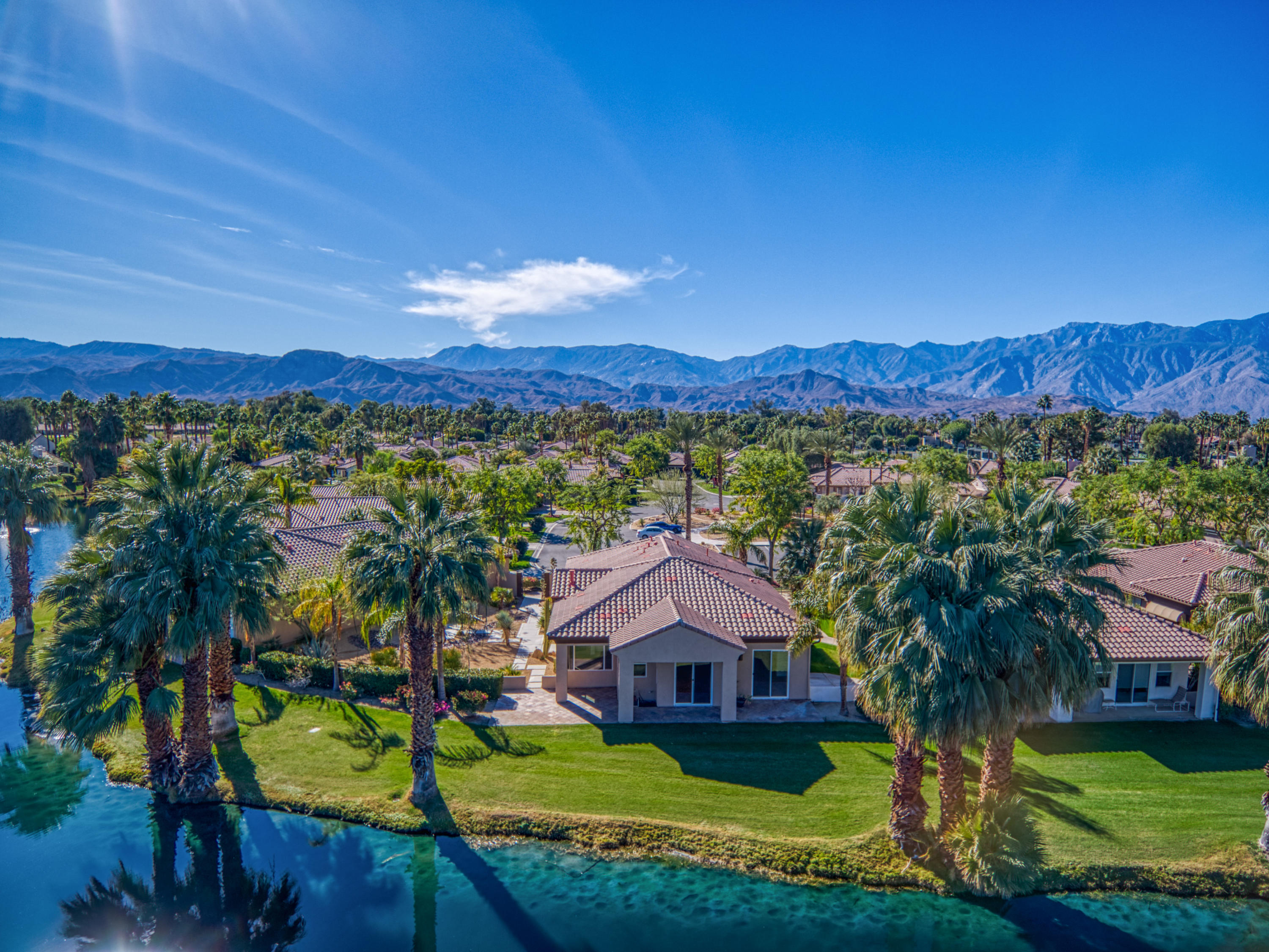 13 Wimbledon Circle Rancho Mirage, CA 92270 - Photo 6 of 62 a view of house with a yard and swimming pool