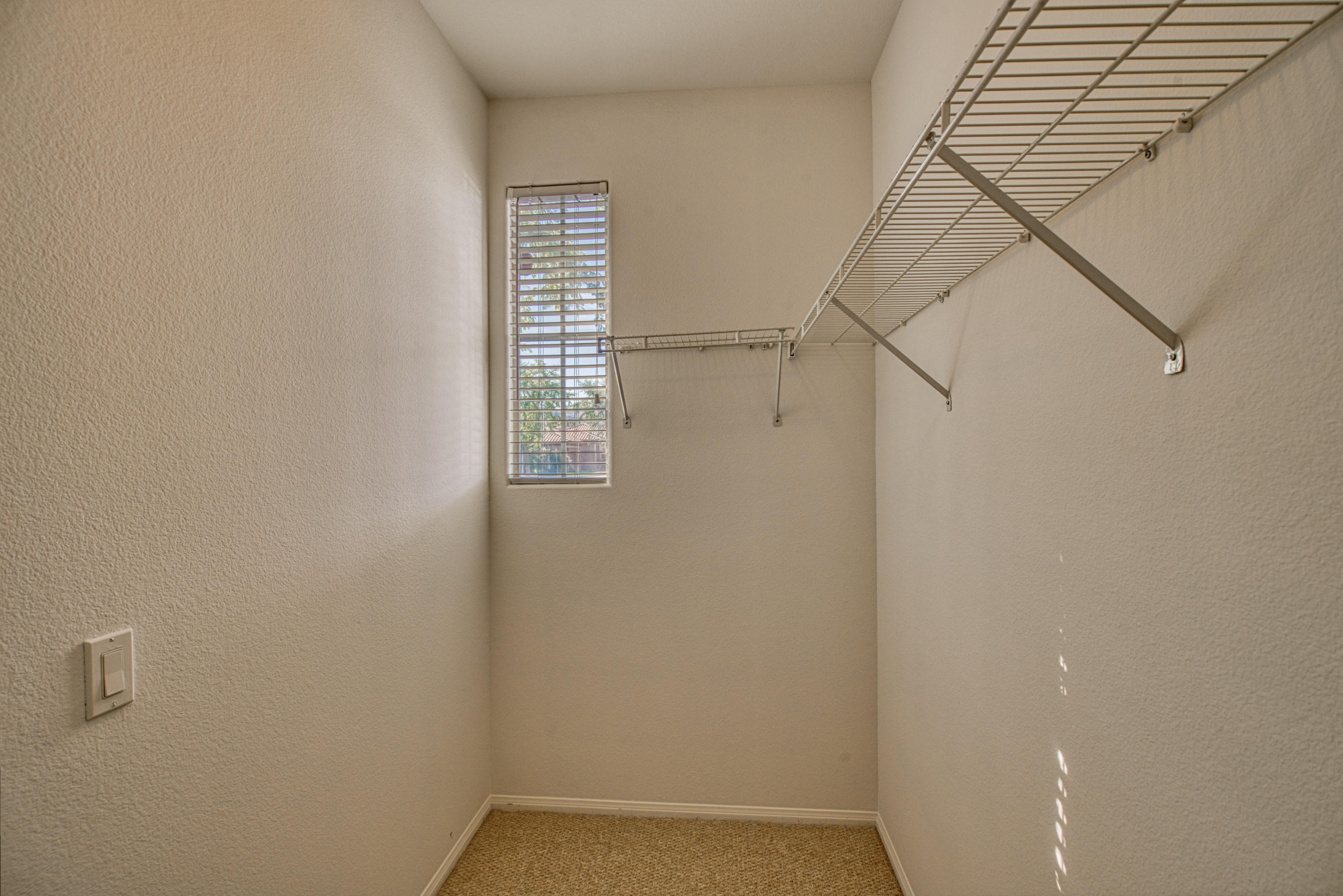 13 Wimbledon Circle Rancho Mirage, CA 92270 - Photo 51 of 62 a view of small space with racks on the wall