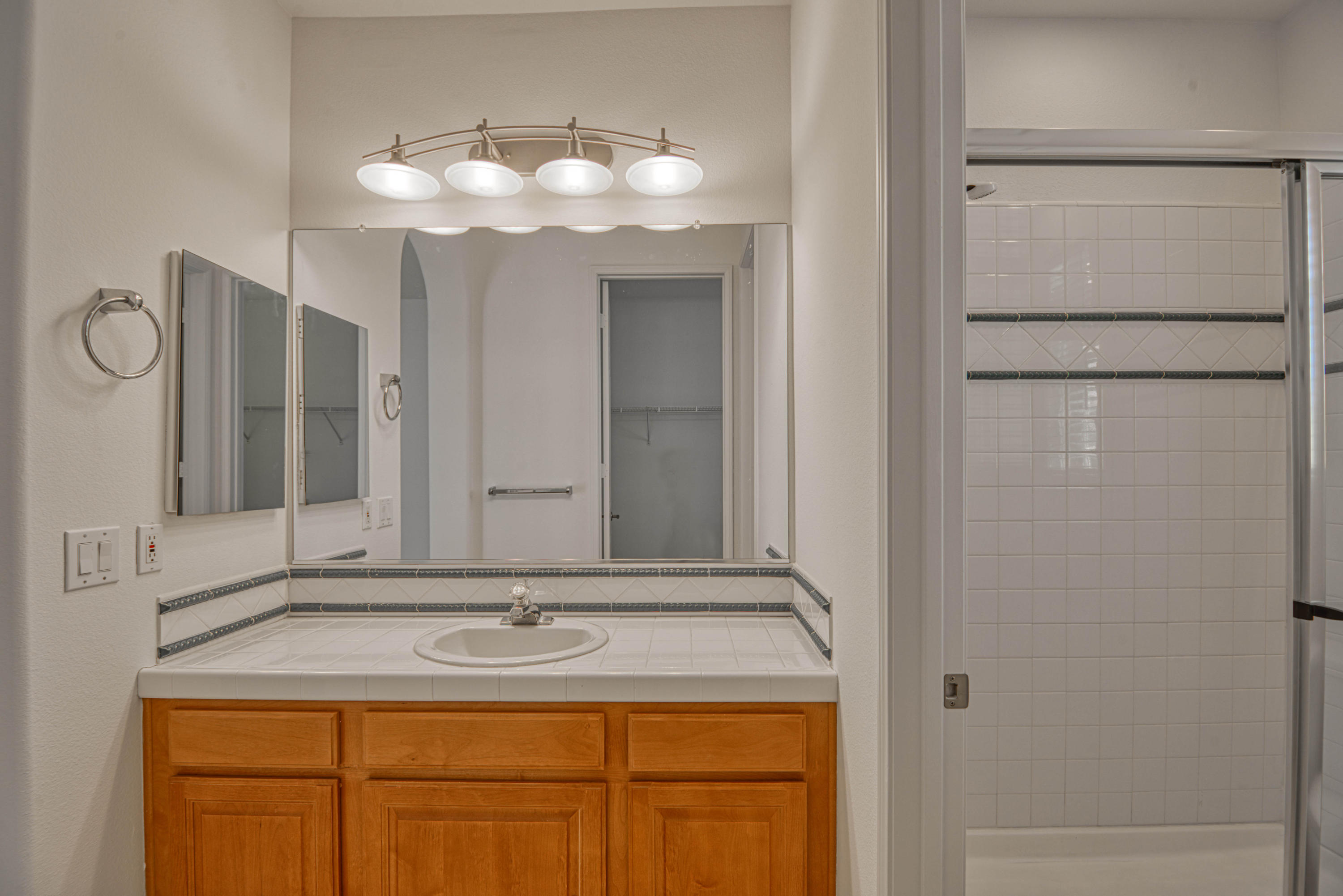 13 Wimbledon Circle Rancho Mirage, CA 92270 - Photo 52 of 62 a bathroom with a sink and a mirror