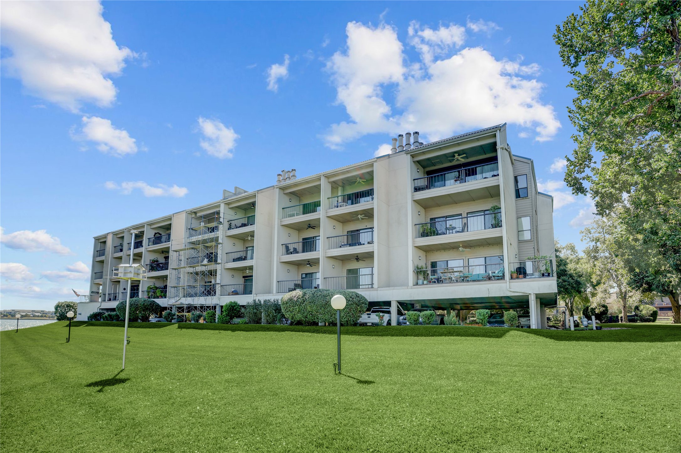 351 Lakeside Lane, Unit 102 Houston, TX 77058 - Photo 14 of 14 a view of a building with a yard