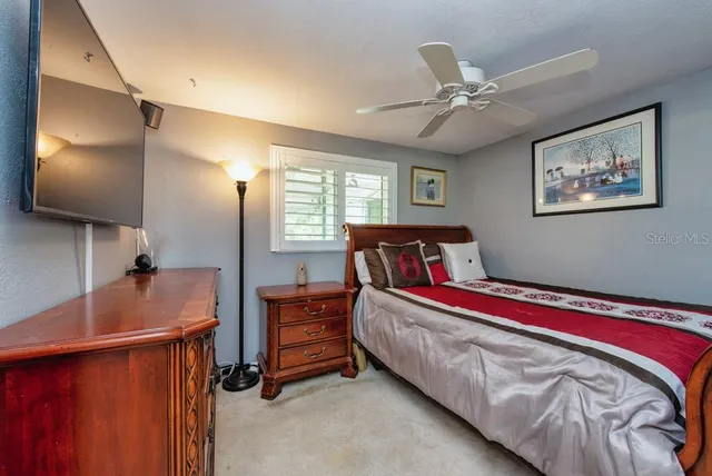 a bed room with a bed and a chandelier