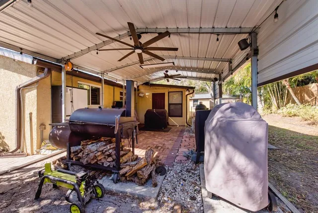 a view of a chairs and table in a patio