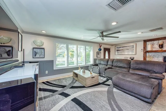 a living room with furniture and a window