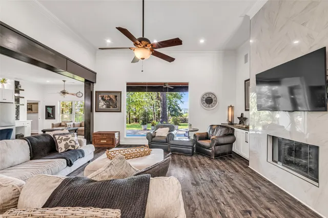a living room with furniture fireplace and a flat screen tv