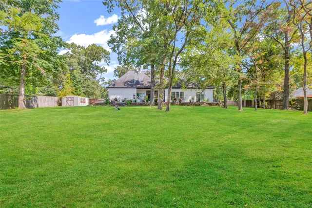 a view of a house with a big yard