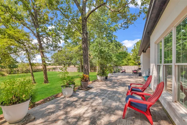 a view of a backyard with sitting area