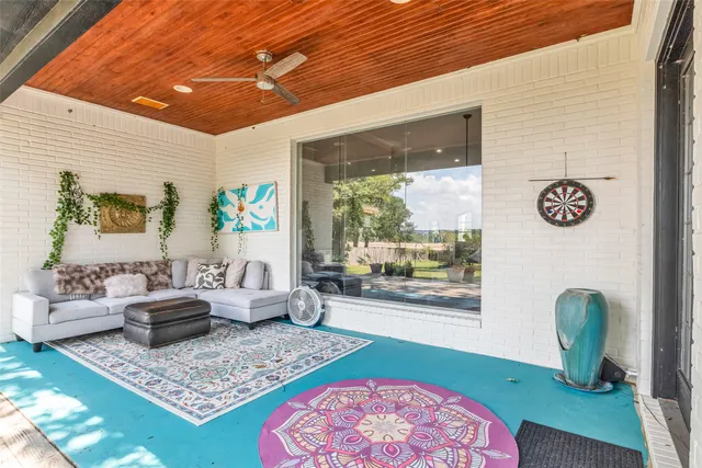 a living room with furniture and a rug