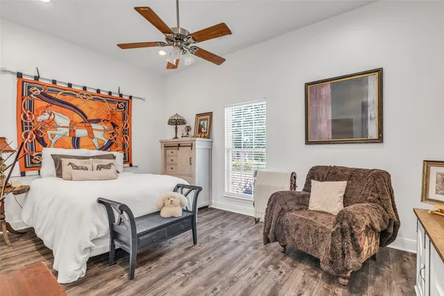 a bedroom with a bed and a couch