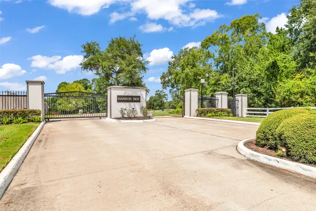 a front view of a house with a yard and a garage