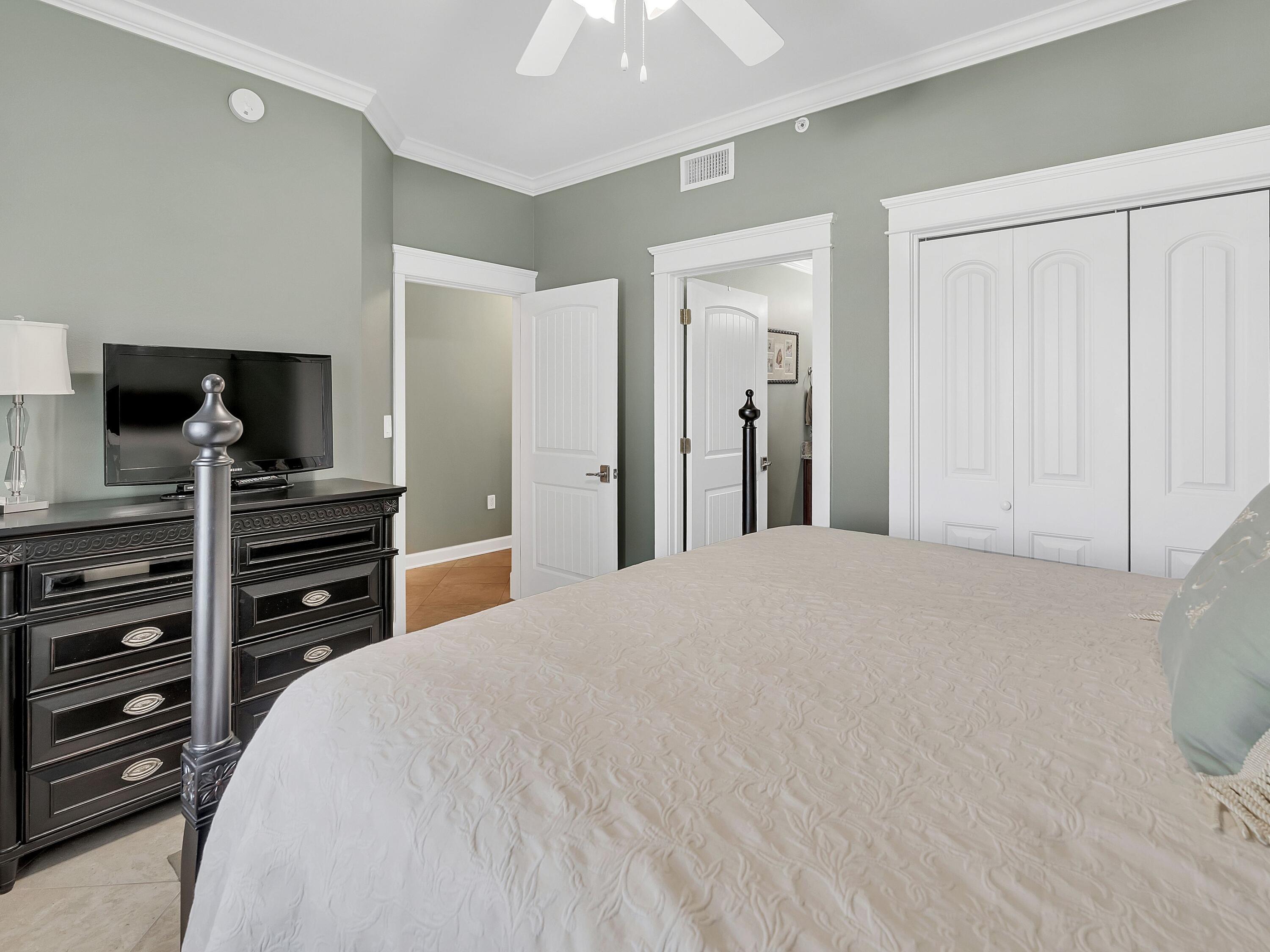 548 Sandy Cay Drive, Unit 510 Miramar Beach, FL 32550 - Photo 15 of 30 a bedroom with a bed and a television