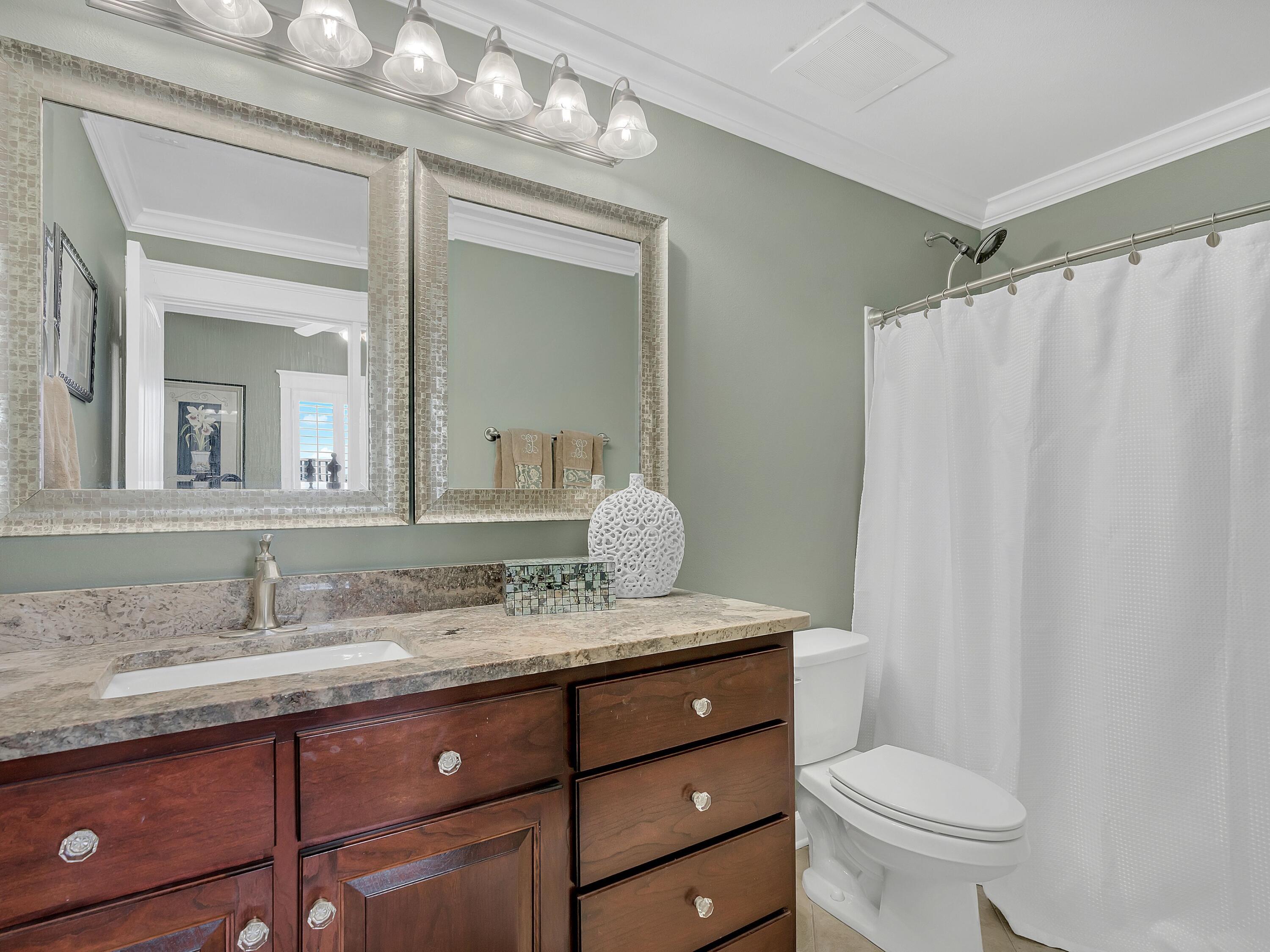548 Sandy Cay Drive, Unit 510 Miramar Beach, FL 32550 - Photo 16 of 30 a bathroom with a granite countertop sink toilet and mirror