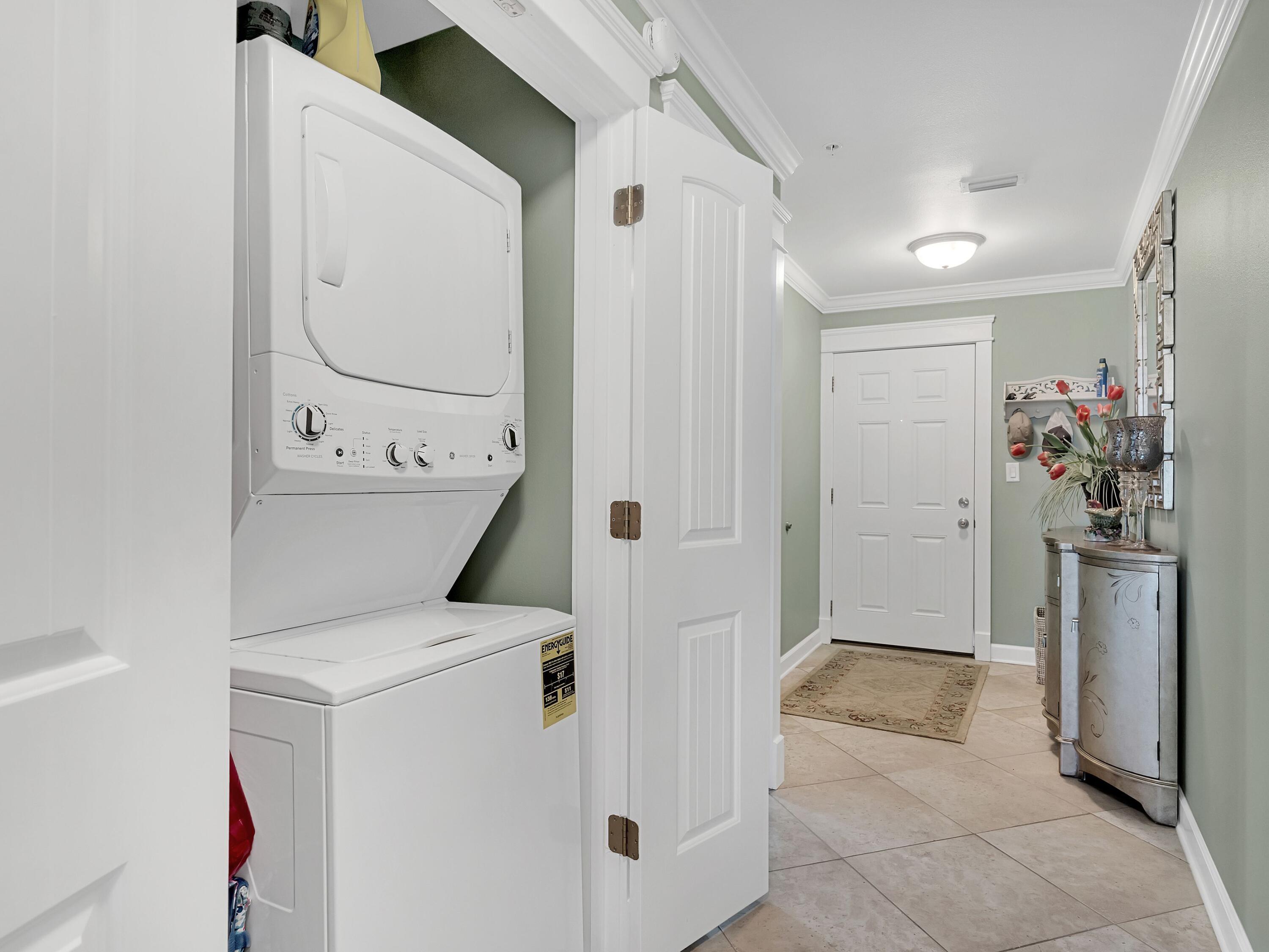548 Sandy Cay Drive, Unit 510 Miramar Beach, FL 32550 - Photo 17 of 30 a view of kitchen with washer and dryer
