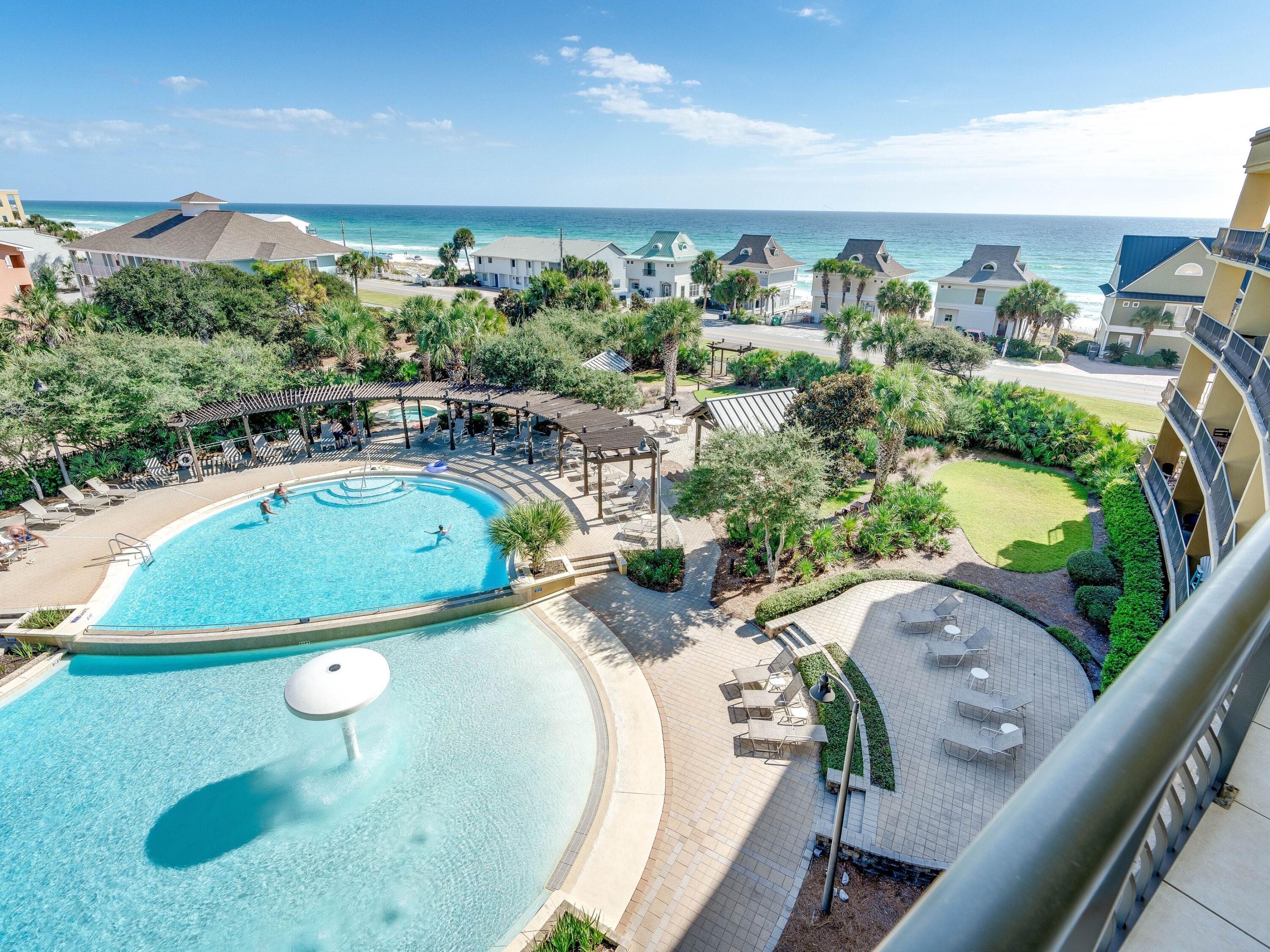 548 Sandy Cay Drive, Unit 510 Miramar Beach, FL 32550 - Photo 21 of 30 a view of a swimming pool and outdoor seating