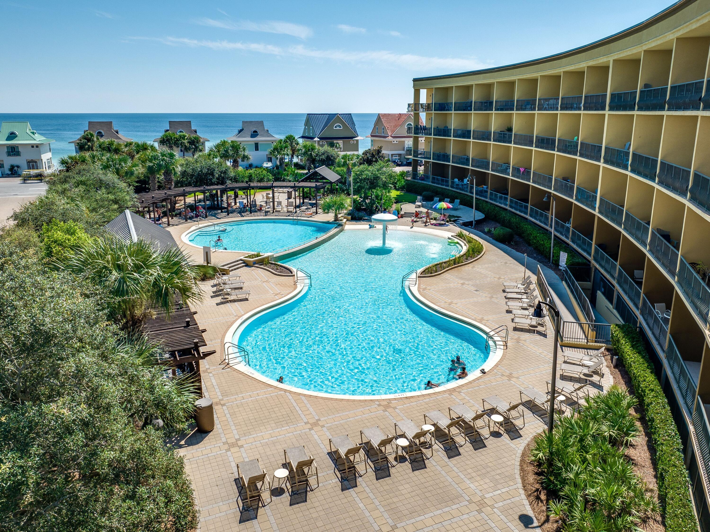548 Sandy Cay Drive, Unit 510 Miramar Beach, FL 32550 - Photo 24 of 30 an aerial view of a swimming pool with outdoor seating and yard