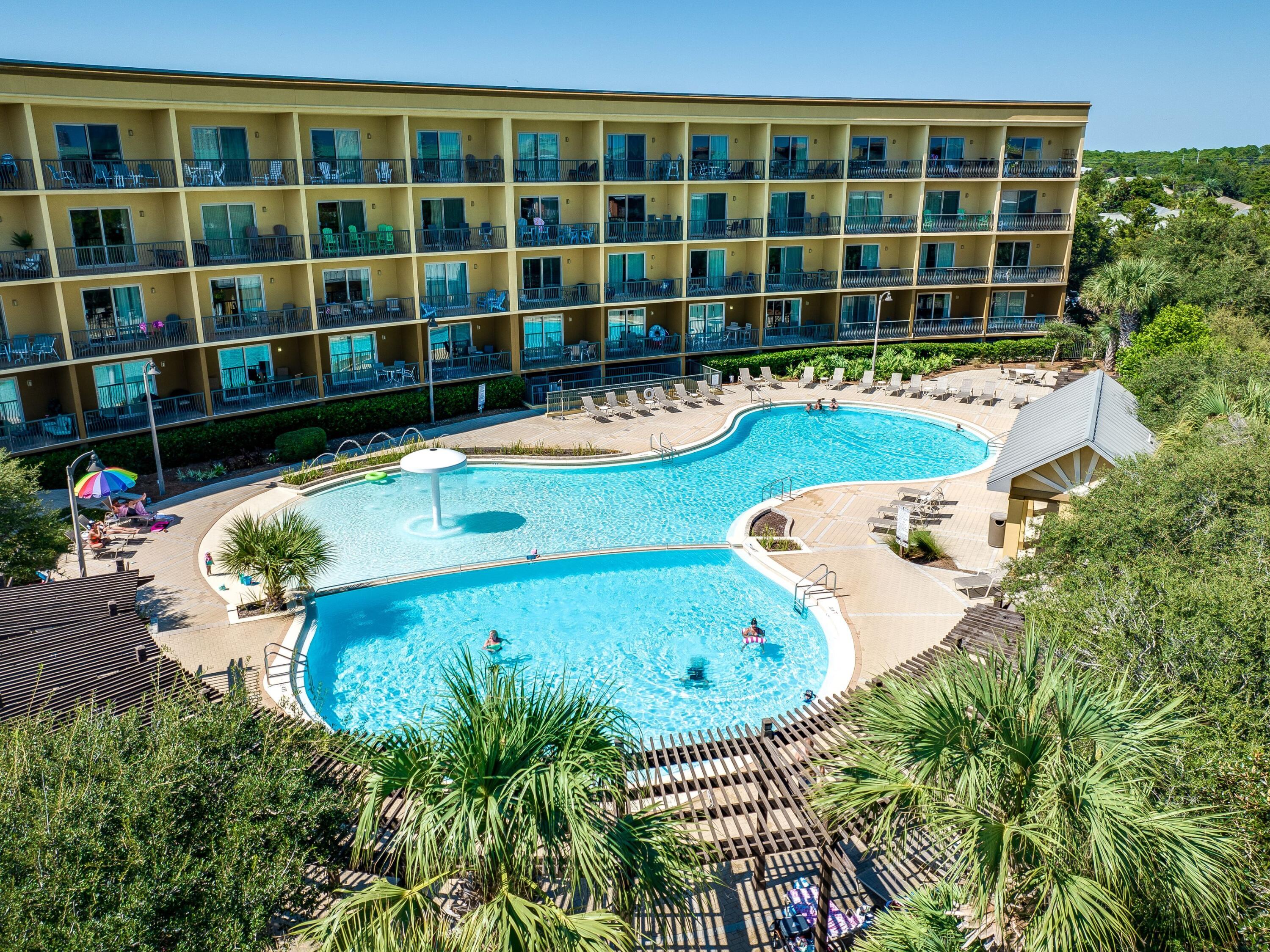 548 Sandy Cay Drive, Unit 510 Miramar Beach, FL 32550 - Photo 25 of 30 a view of a swimming pool with potted plants