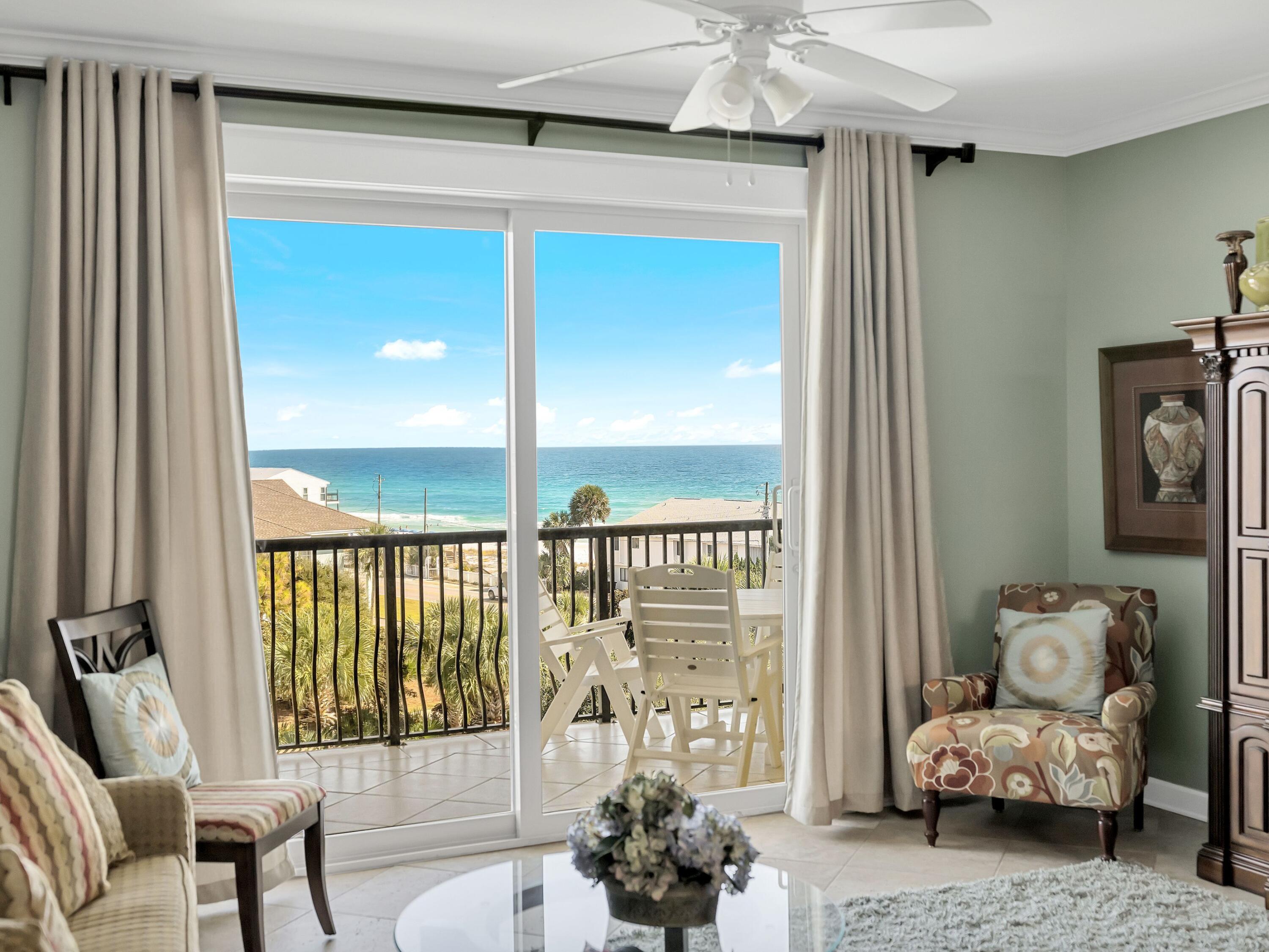 548 Sandy Cay Drive, Unit 510 Miramar Beach, FL 32550 - Photo 5 of 30 a living room with furniture and a floor to ceiling window