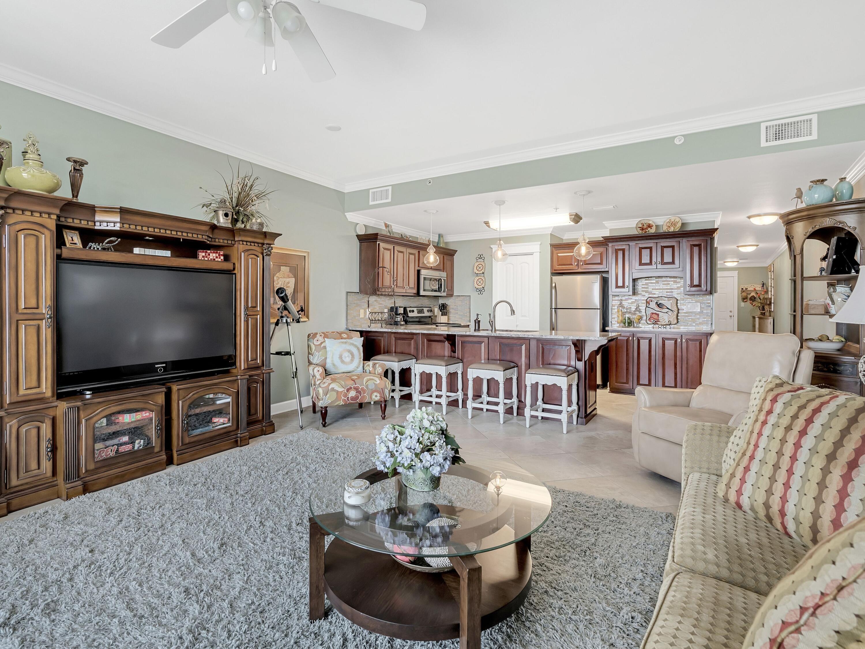 548 Sandy Cay Drive, Unit 510 Miramar Beach, FL 32550 - Photo 8 of 30 a living room with furniture and a flat screen tv