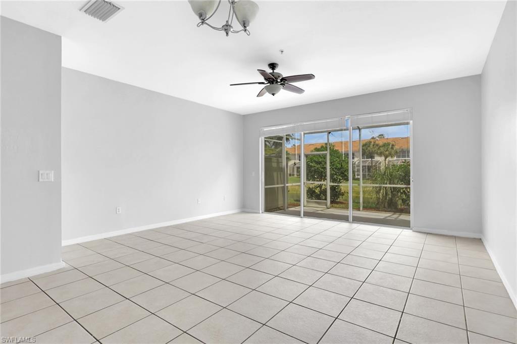 937 Hampton Circle, Unit 108 Naples, FL 34105 - Photo 11 of 32 a view of an empty room with a window