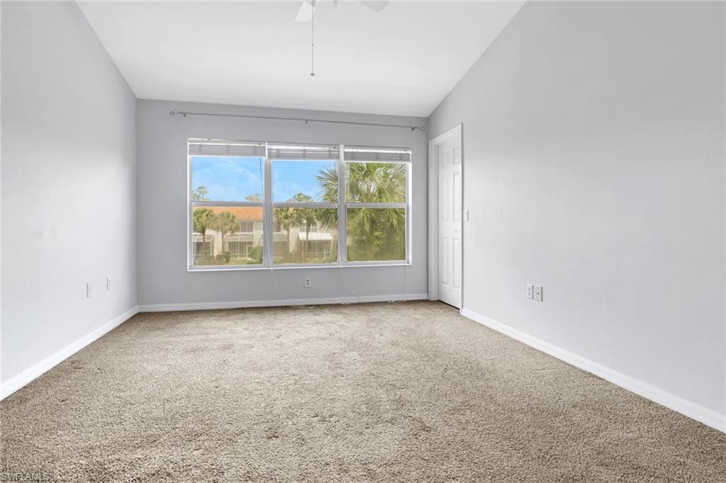 937 Hampton Circle, Unit 108 Naples, FL 34105 - Photo 15 of 32 an empty room with windows