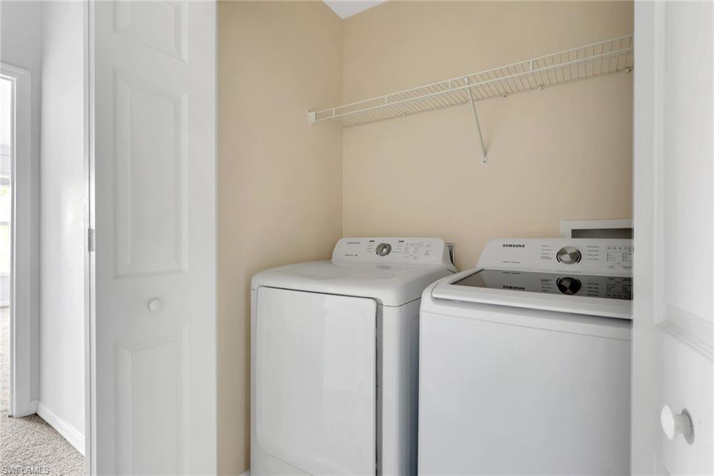937 Hampton Circle, Unit 108 Naples, FL 34105 - Photo 22 of 32 a utility room with dryer and washer