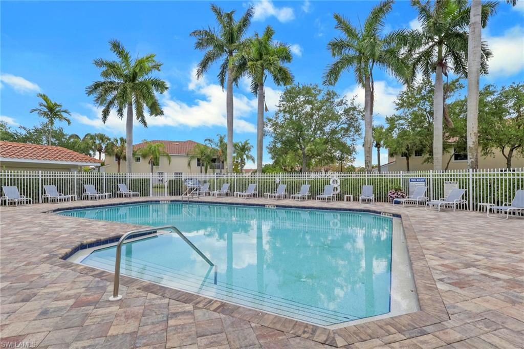 937 Hampton Circle, Unit 108 Naples, FL 34105 - Photo 28 of 32 a view of swimming pool with outdoor seating and plants