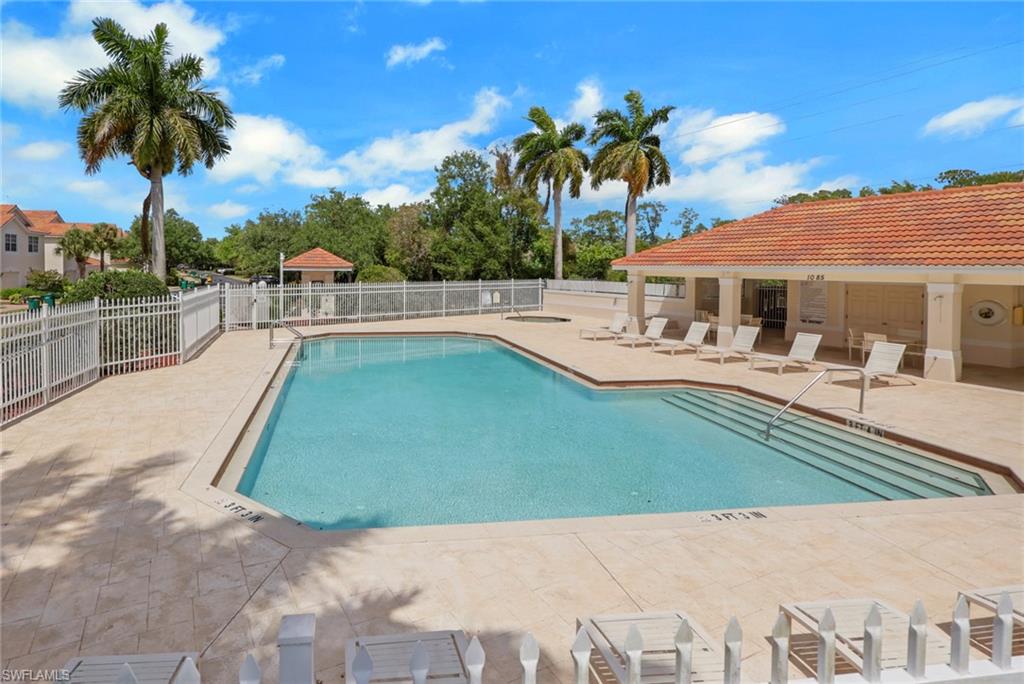 937 Hampton Circle, Unit 108 Naples, FL 34105 - Photo 29 of 32 a view of a backyard with a patio and palm trees