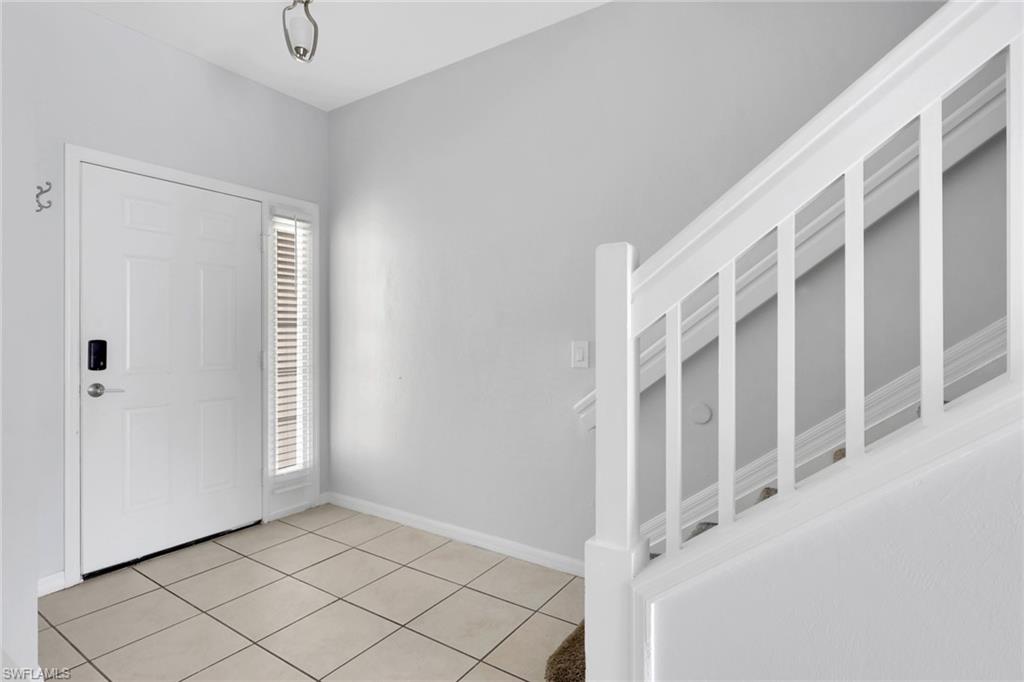 937 Hampton Circle, Unit 108 Naples, FL 34105 - Photo 3 of 32 a view of staircase with white walls